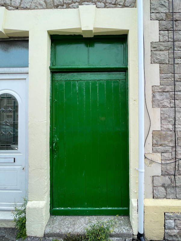 Green front door that looks like a garden gate, Weston-super-Mare, May 2023