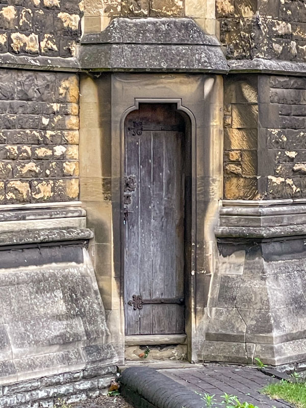 Slim church door, Lincoln, June 2023