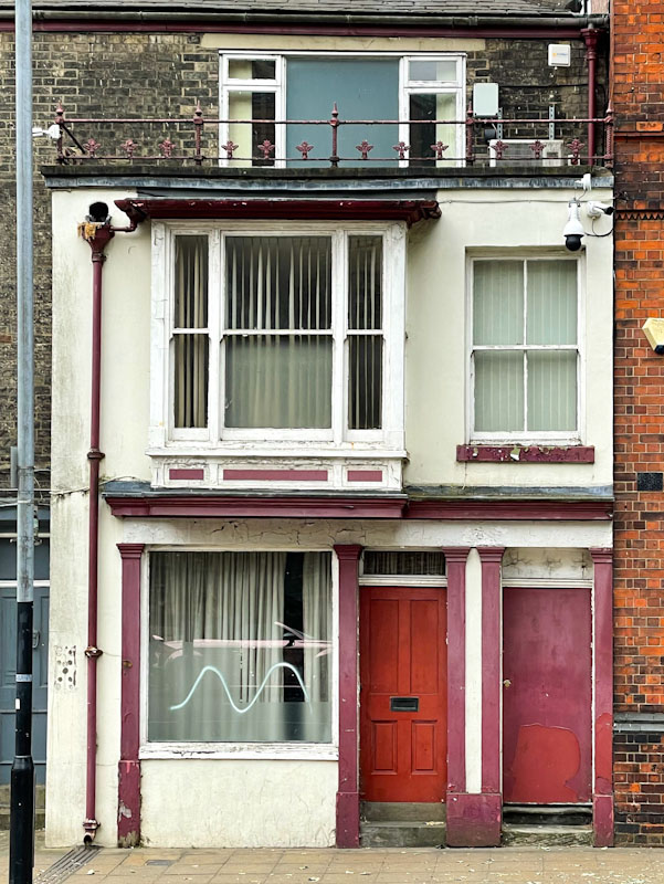 Building and doors have seen better days , Lincoln, June 2023