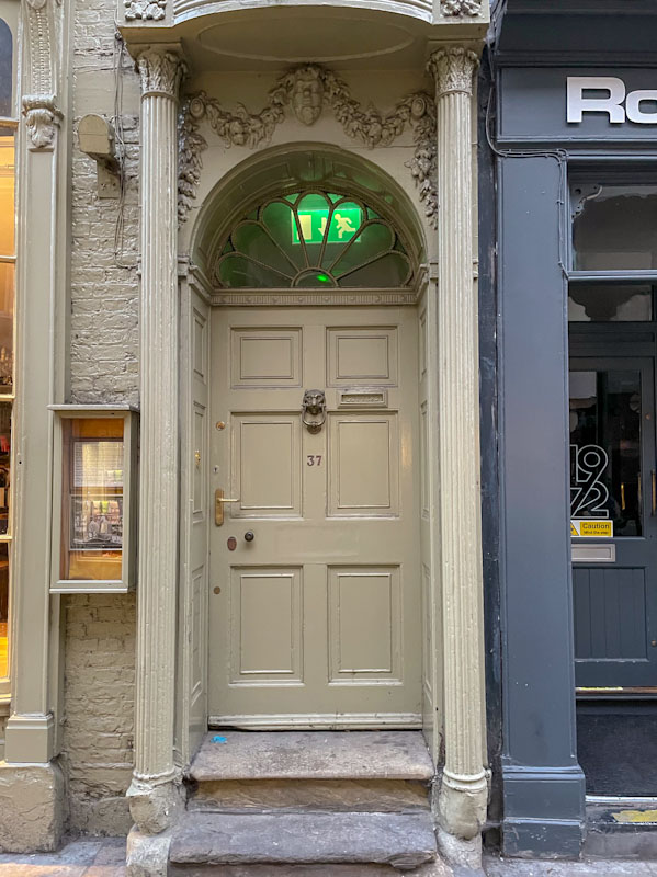 Fancy door surround and fan light (including ugly fire exit sign), York, June 2023