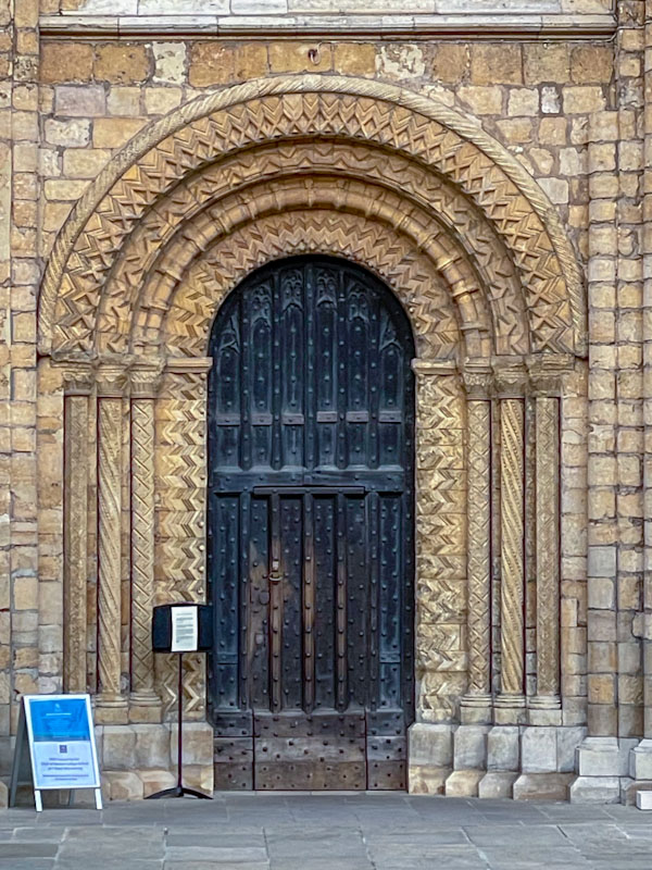 Early English Gothic doorway and door within a door on the west entrance to Lincoln Cathedral, Lincoln City, July 2023