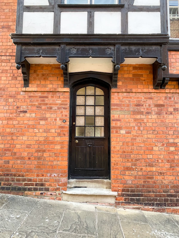 Black door on a hill, Lincoln, July 2023