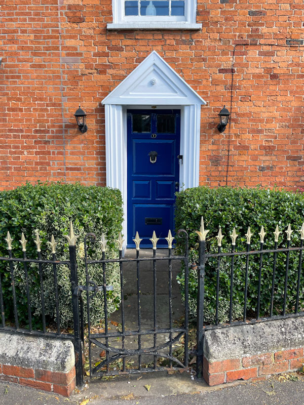 Blue door and iron gate, Lincoln, July 2023