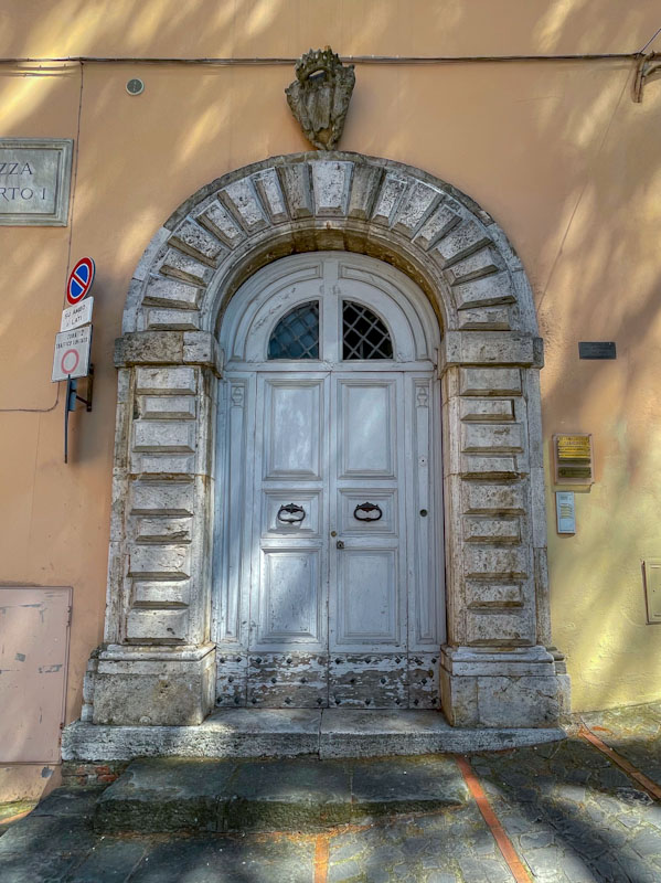 Fine double doors and hefty stone work, Todi, Umbria, Italy, July 2023