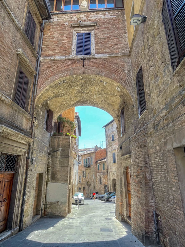 Some cheeky doors, but it was the archway I was photographing, Perugia, Umbria, Italy, July 2023