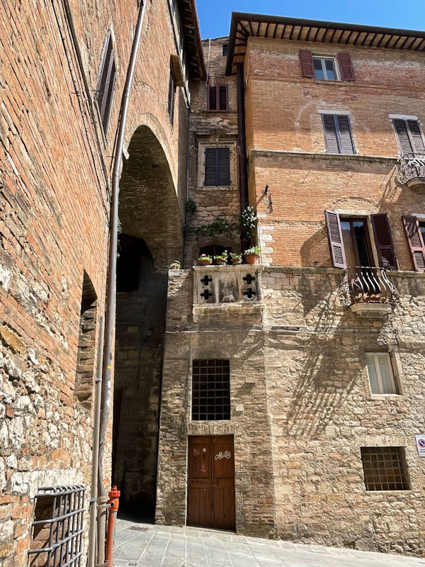 Plain door to the thinnest house? Perugia, Umbria, Italy, July 2023