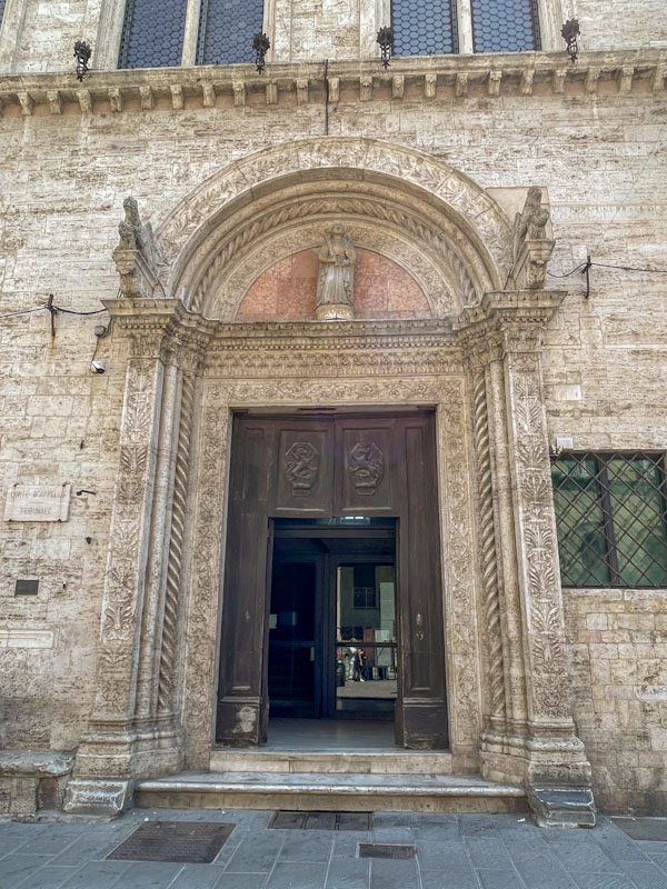 Church door and impressive stone work, Perugia, Umbria, Italy, July 2023