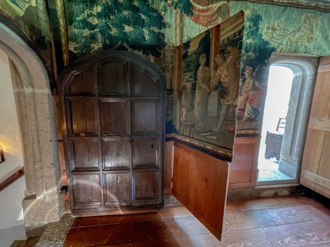 Entrance door, hidden tapestry door and exit door, Cotehele, Cornwall, August 2023