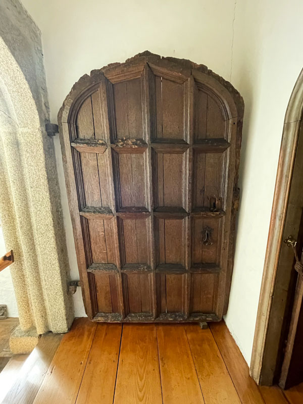 Well worn panelled door, Cotehele, Cornwall, August 2023