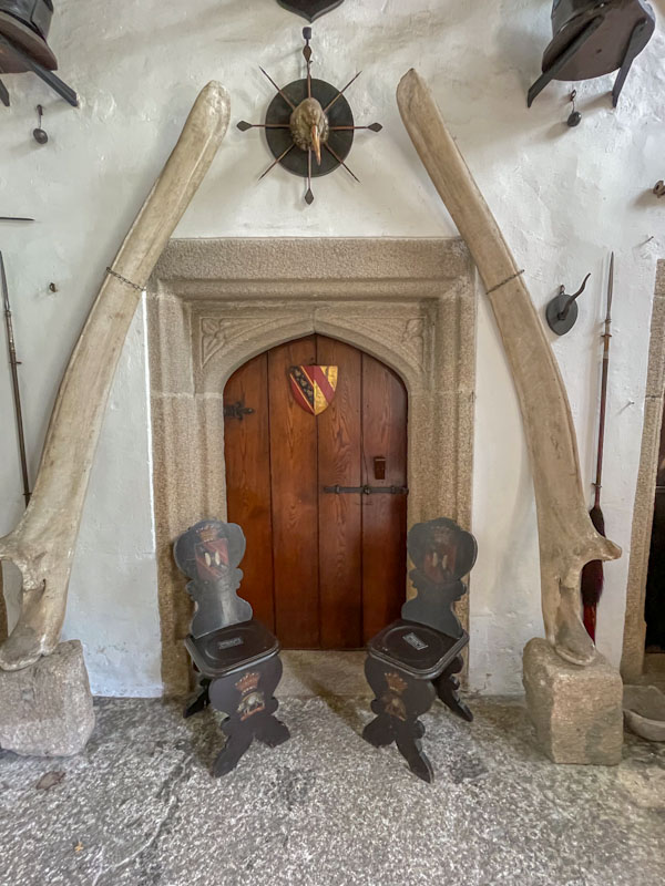 Main hall door adorned with a whalebone? arch, Cotehele, Cornwall, August 2023