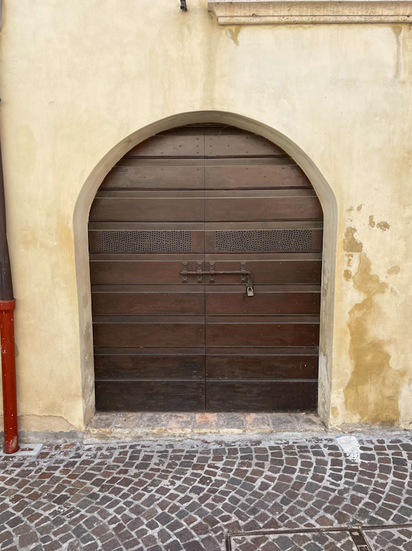 Modern arched door, Montefalco, Umbria, Italy, July 2023