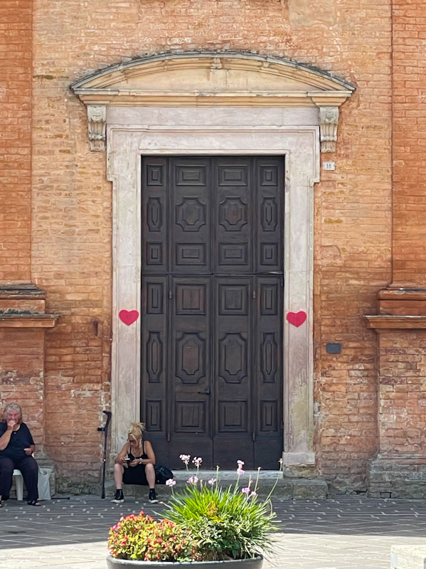 Close up of a door in the town square, Montefalco, Umbria, Italy, July 2023