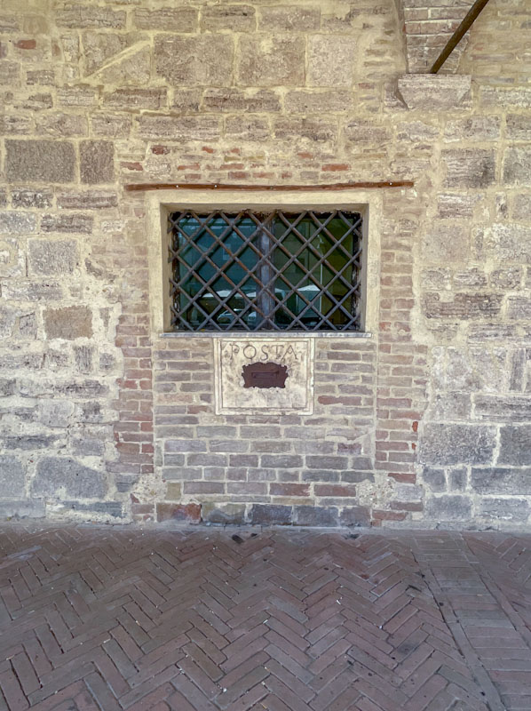 Ghost door and post box, Montefalco, Umbria, Italy, July 2023