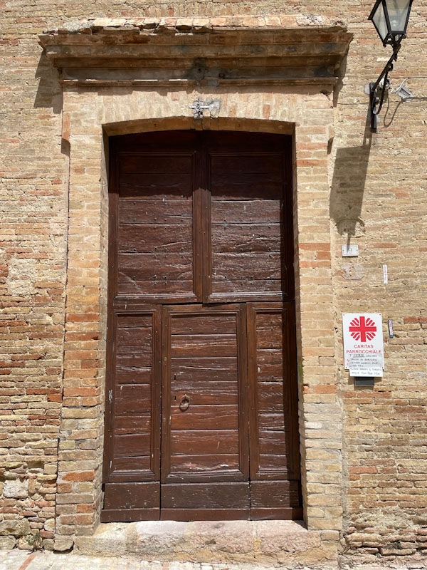 Door within a larger doorway, Montefalco, Umbria, Italy, July 2024