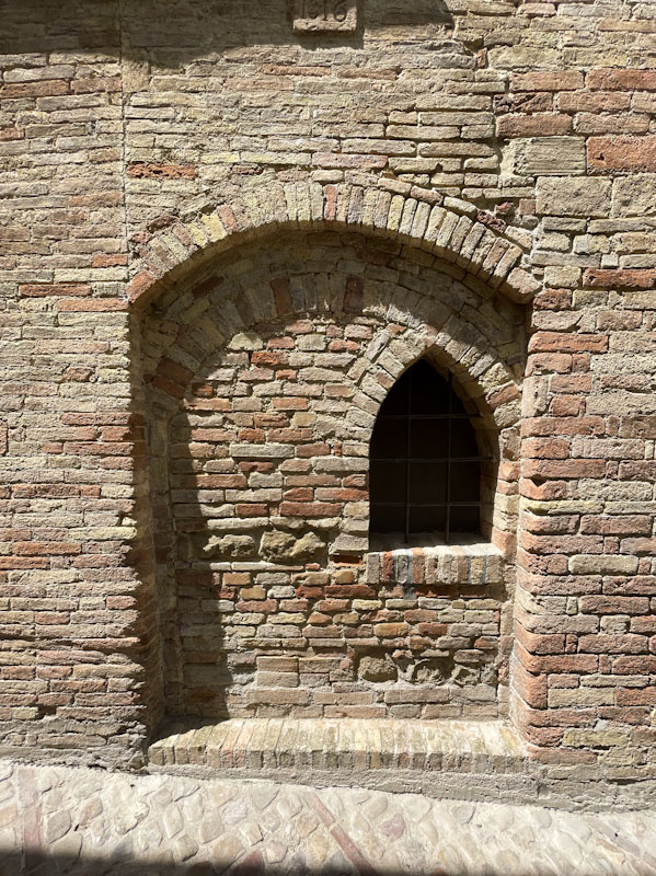 Ghost door with an arched window, Montefalco, Umbria, Italy, July 2024