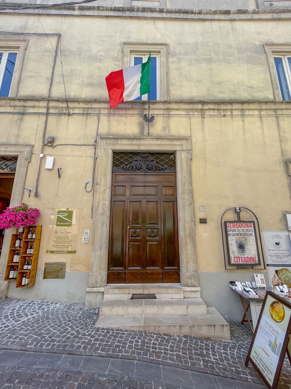 Grand door on a hill, Montefalco, Umbria, Italy, July 2024