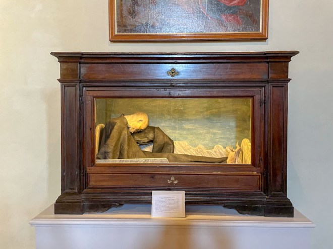 Casket with hinged door, containing remains, Montefalco, Umbria, Italy, July 2024