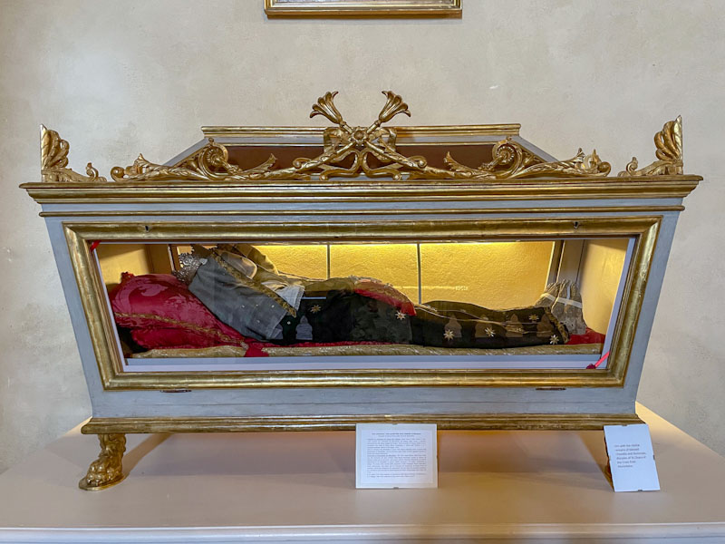 Casket with hinged door, containing remains of Chiarella and Illuminata, Montefalco, Umbria, Italy, July 2024