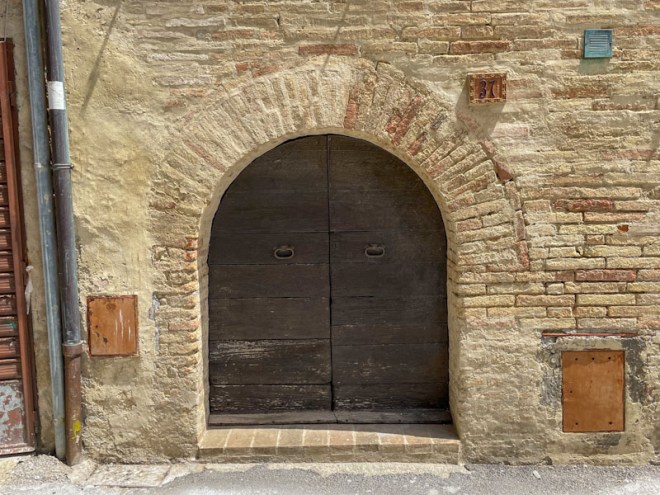 Small, double door arch, Montefalco, Umbria, Italy, July 2023