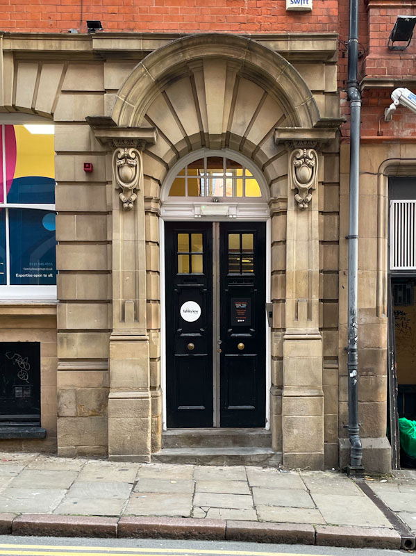 Black doors and wonderful stone surround, Nottingham, November 2023
