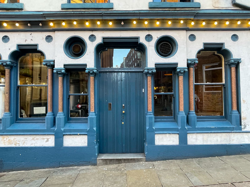 Ornate windows and shop front with rather plain doors, Nottingham, November 2023