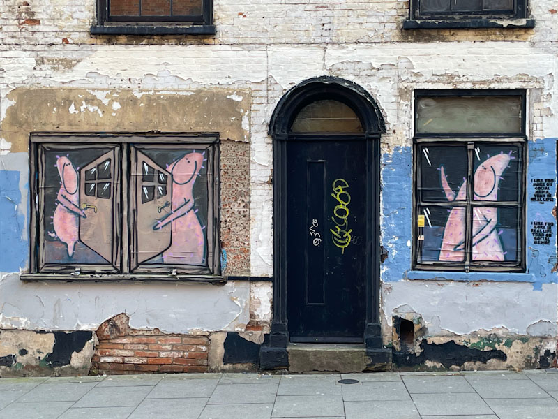 Door with witty street art, Nottingham, November 2023