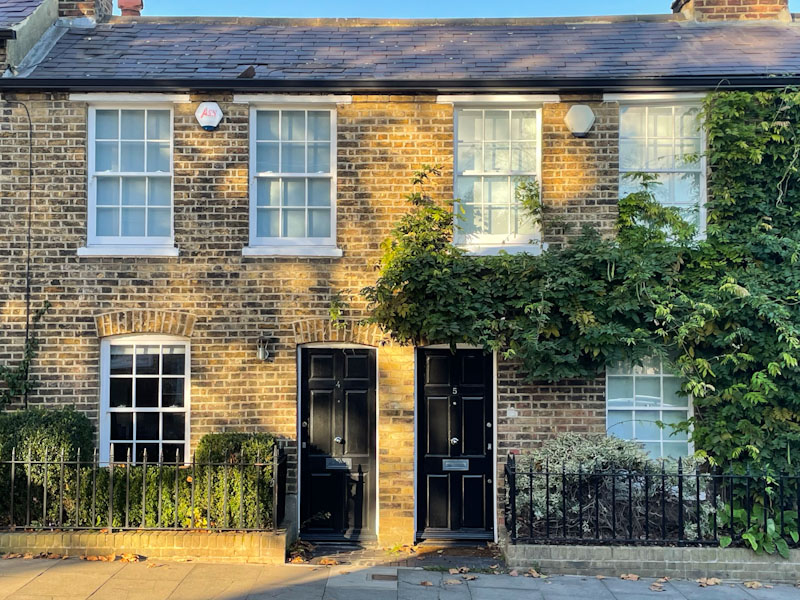 Two black doors, Highgate, London, November 2023