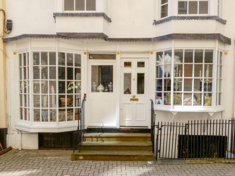 Double doors with one sealed up, Cheltenham, July 2023