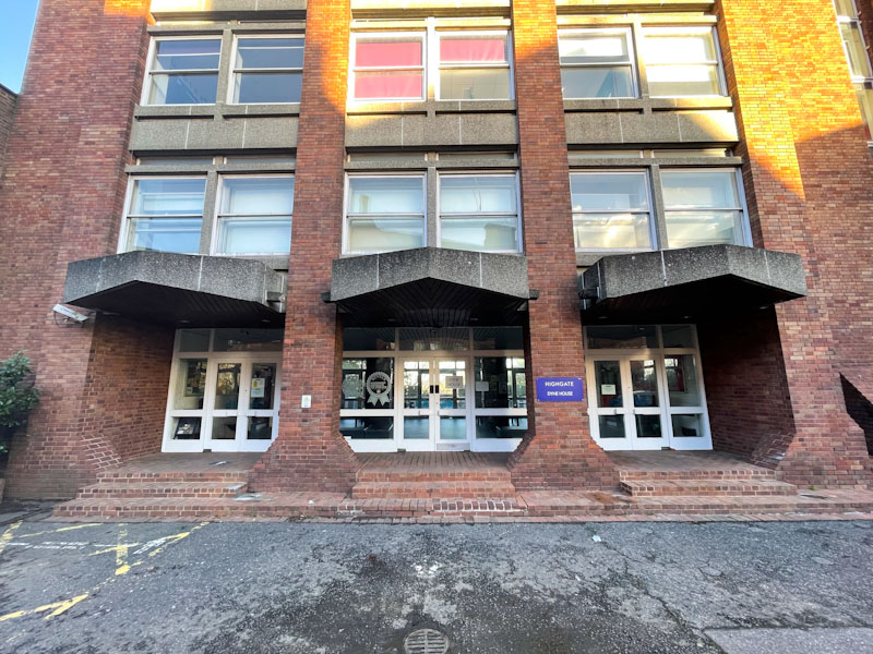 Doors in the entrance to the 'modern' Dyne House, Highgate School, Highgate, London, November 2023
