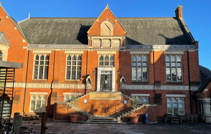Door and stairs to the main school hall, Highgate School, Highgate, London, November 2023