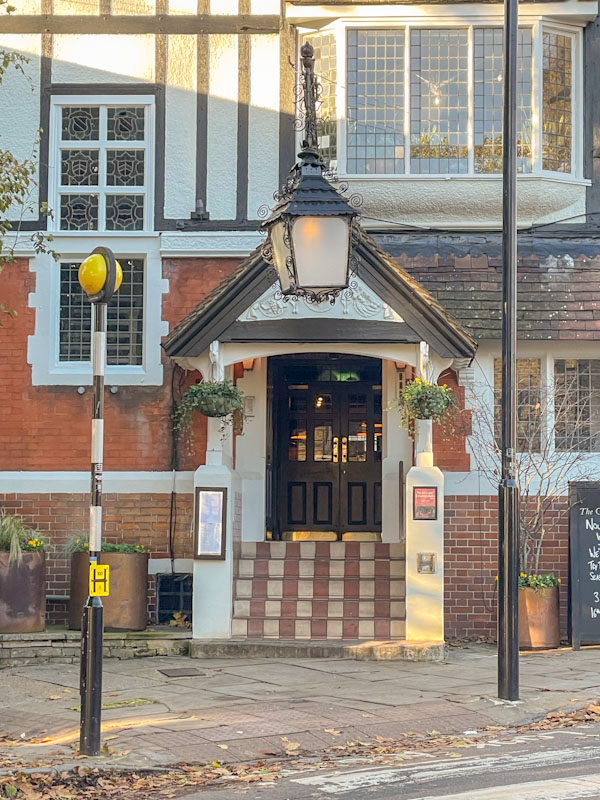 The Gatehouse entrance door and lamp, Highgate , London, November 2023