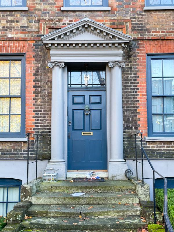 Blue door with fine columns and portico, Highgate, London, November 2023