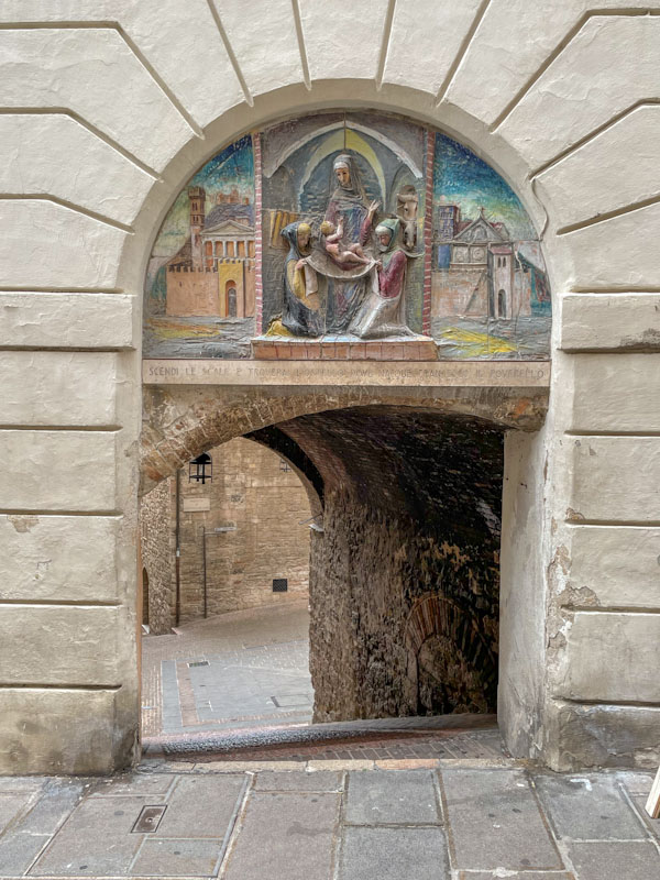 Archway and shrine, Assisi, Umbria, Italy, July 2023