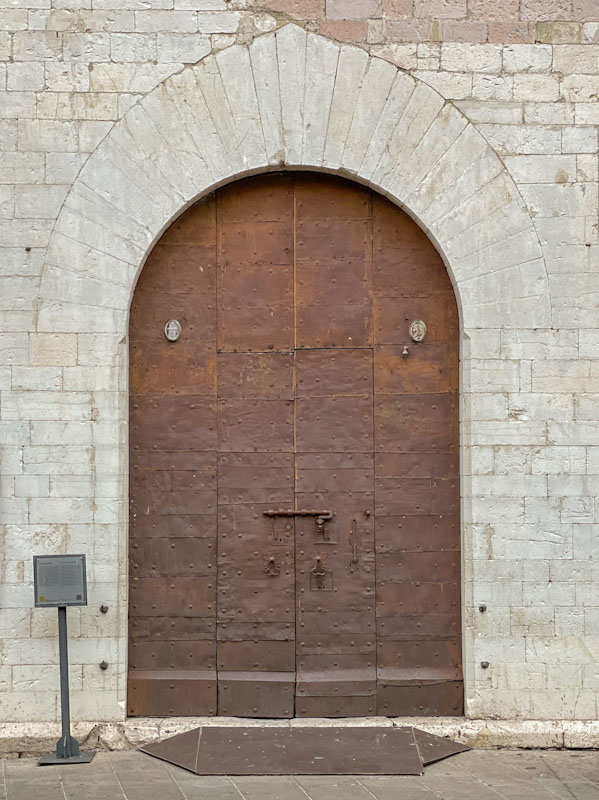 Door within a large door, Assisi, Umbria, Italy, July 2023