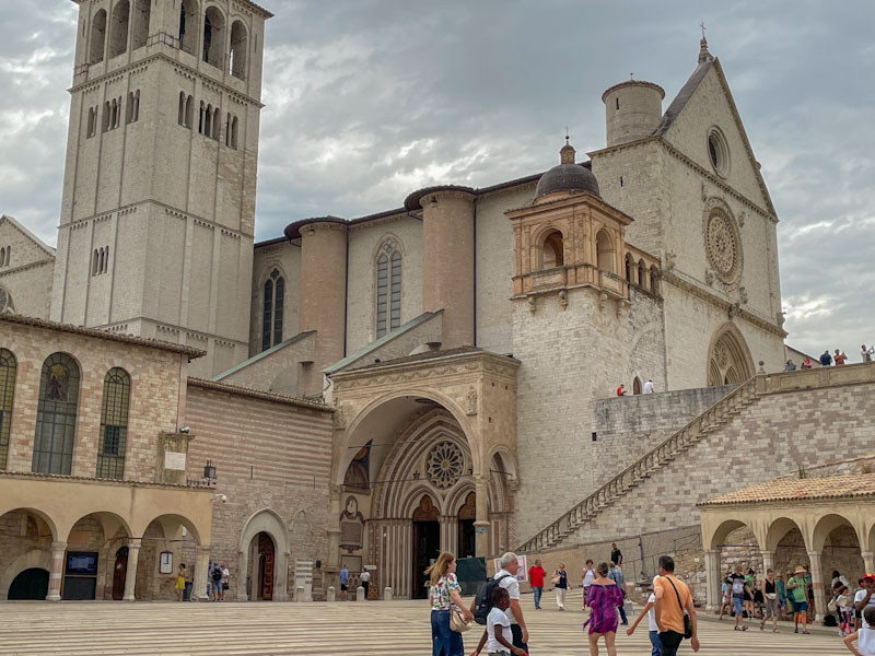 Side doors and entrance to the Basilica di San Francesco, Assisi, Umbria, Italy, July 2023