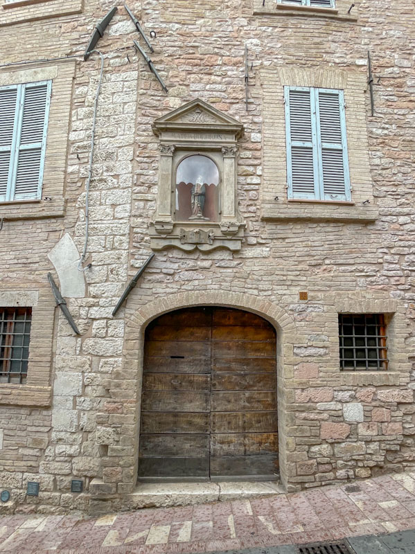 Doors and shrine, Assisi, Umbria, Italy, July 2023