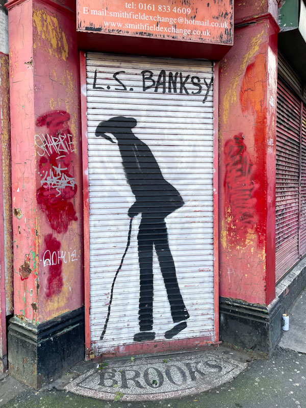 LS Banksy (Lowry) door shutter, Manchester, November 2023