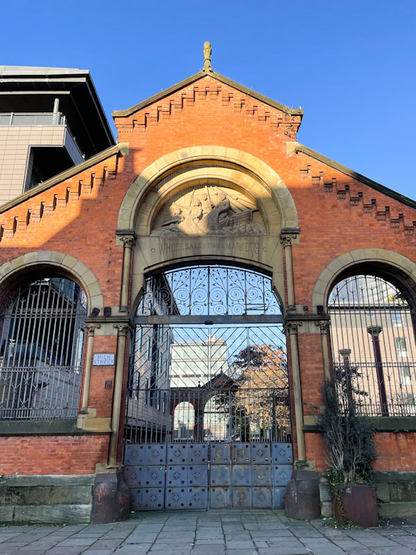 Old wholesale fish market entrance gateway, Manchester, November 2023