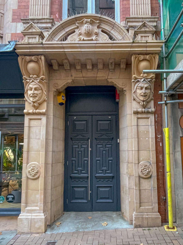 Black doors and fancy stone faces, Birmingham, November 2023
