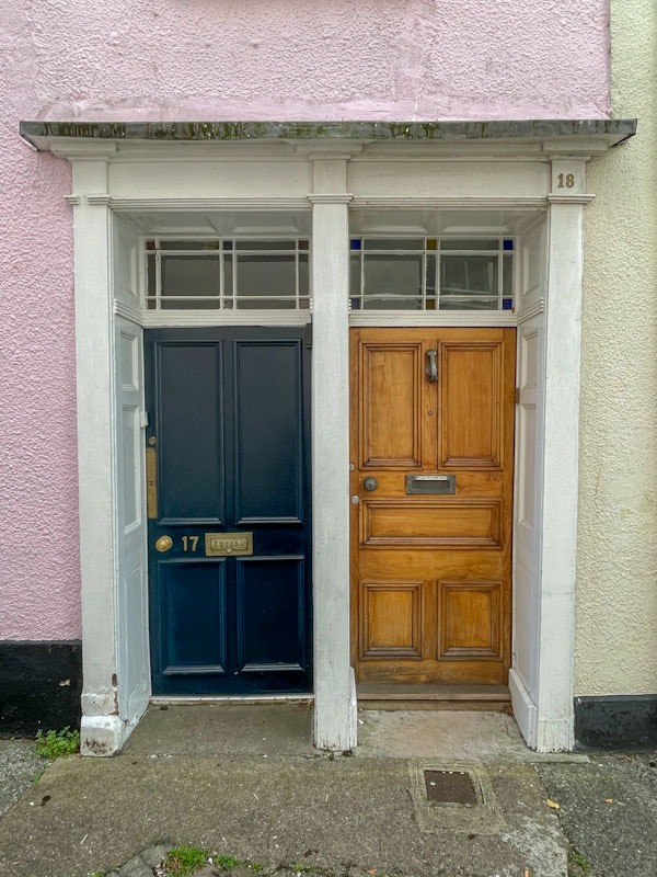 Different doors in a shared doorway, Exeter, October 2023