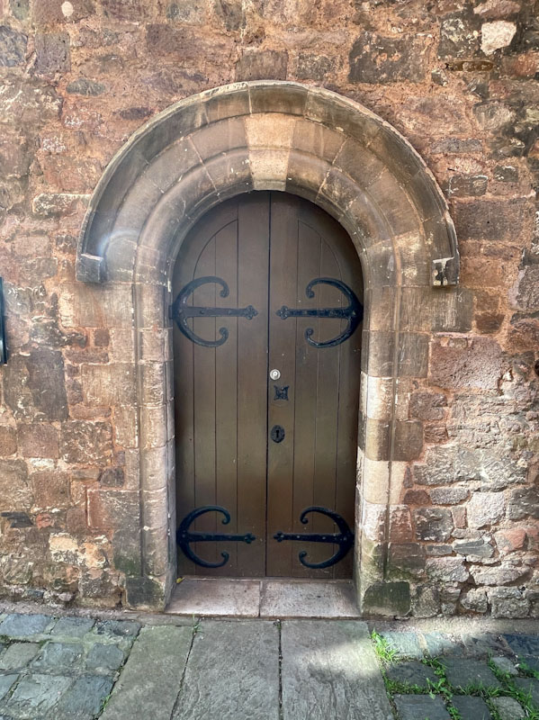 Church door with stone archway, Exeter, October 2023