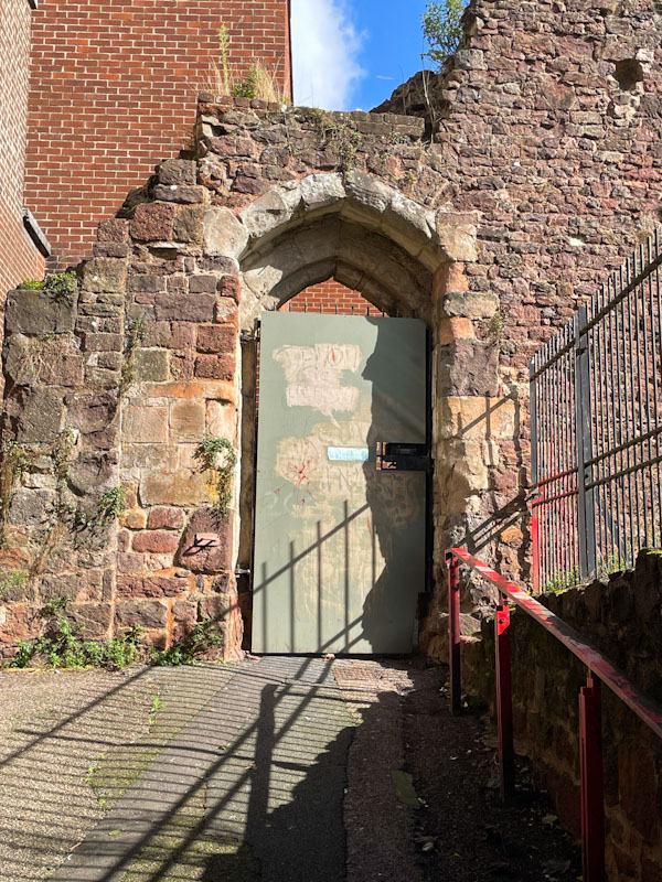 A 'keep out' kind of door on a ruin, Exeter, October 2024