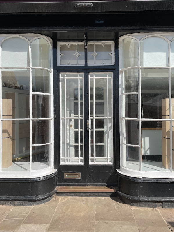 Mol's Coffee House front door and curved glass windows, Exeter, October 2024