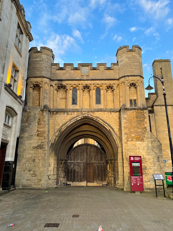 Norman gateway and double doors (not a perfect fit), Cathedral Square, Peterborough, April 2024