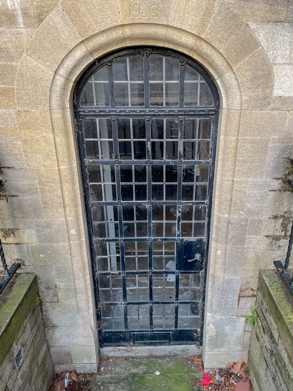 1930 iron and glass latticed door, Peterborough, April 2024