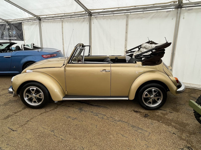 Convertible Volkswagen beetle with roof 'door', Buxton, Derbyshire, April 2024