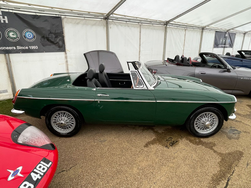 Green door, green classic car, Buxton, Derbyshire, April 2024