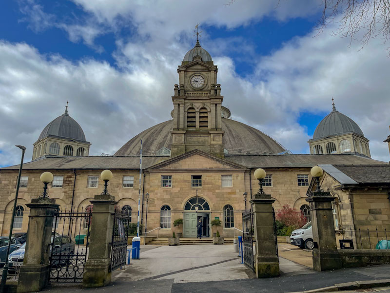 Doors and entrance to the Devonshire Dome building, Buxton, Derbyshire, April 2024