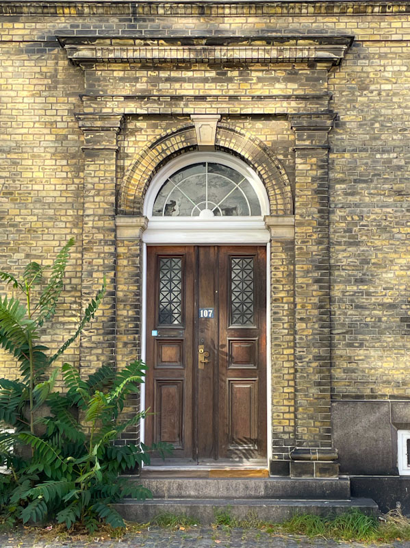 Grand doors, skylight and brick surround, Borgergade, Copenhagen, Denmark, September 2024