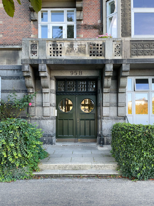 Stunning doors with circular windows on the path alongside Sortedams So, Copenhagen, September 2024